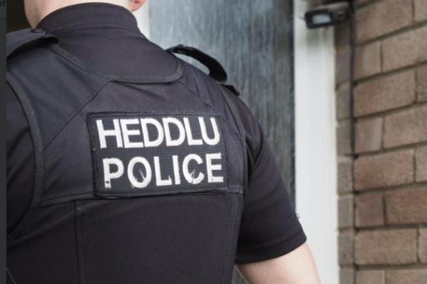 An Ammanford woman has been charged with assaulting her husband by beating