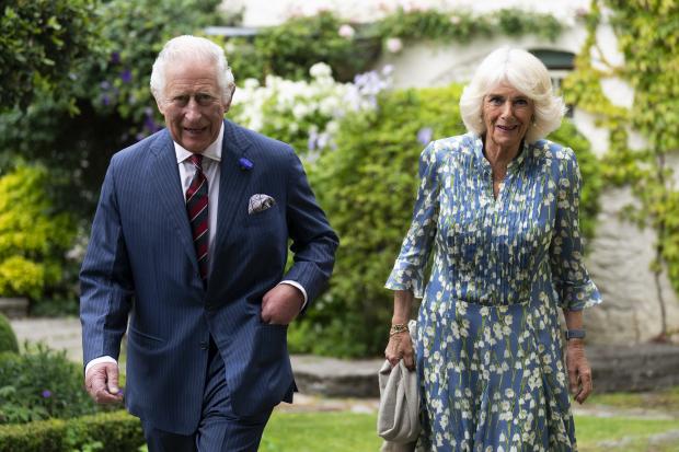 HRH Prince Charles and Camilla walking from Llwynywermod farmhouse to the barn
Picture: PR
