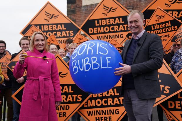 South Wales Guardian: Newly elected Liberal Democrat MP Helen Morgan bursts ‘Boris’ bubble’ as she celebrates her victory (Jacob King/PA)