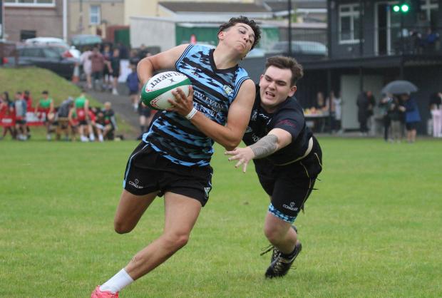 South Wales Guardian: Sam Potter of Ammanford RFC Youth nips in for a touchdown. Picture: Roland Danter