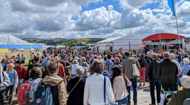 South Wales Guardian: A large crowd congregated outside the Welsh Government's stand on the Eisteddfod maes as part of Cymdeithas yr Iaith's rally calling for a Property Act (Image: Twitter/Cymdeithas yr Iaith).