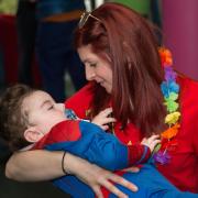 Registered nurse Katie Bonne with Ollie, one of the children who is using the services at Ty Hafan Children Hospice