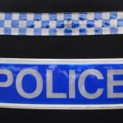 A woman has been charged with assaulting two women in Ammanford.