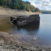 DROUGHT: The emergence of Y Fanog from Llyn Brianne Reservoir. Picture: Emma Miles