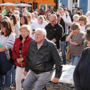 People reflect during a minutes silence in Market Square. Picture: Stuart Ladd