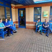 Staff at Pembroke Dock Health Centre with their new benches.