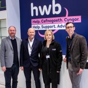 Cefin Campbell MS (left) and Cllr Darren Price (right) meet Carmarthenshire County Council staff at the Hwb in Carmarthen.