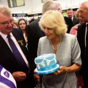 Camilla being presented with cake in 2013 from Little Velvet Cakery Academy