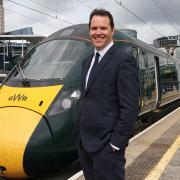 Lee Waters with one of the GWR trains. Picture: GWR