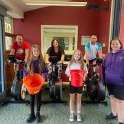 Ysgol y Bedol pupils, staff and parents took part in a bikeathon to raise funds, with guests including Shane Williams (back right). Picture: Ysgol y Bedol