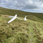 A pilot was injured after his glider crashed in the Black Mountains