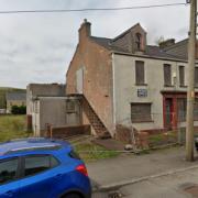 The derelict former club on Heol Cae Gurwen will be demolished and replaced with flats and a home.