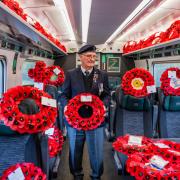 Veteran Melvin Rudge amongst the wreaths on one of the five trains from stations including Carmarthen which transported poppies to London Paddington for a memorial service