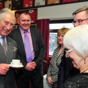 Up for the cup! Then-Prince Charles and current club president Handel Davies share a joke