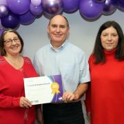 Cheryl and Christopher (pictured with Cllr Sian Harris) were amongst the foster carers recognised at the event