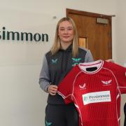 Rhiannon Griffin, Scarlets Women's U18 captain, with Persimmon west Wales managing director Stuart Phillips