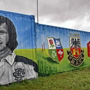 Two of the containers have been completed with an image of Trefor Pryce, the Amman United, WRU and British and Irish Lions crests