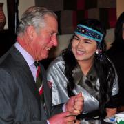 Prince Charles chats to the president of the National Inuit Youth Council, Maatalii Aneraq-Okalik during the round table discussion.
