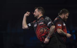 Jonny clayton on the World Championship stage against Michael Smith. Pic: Lawrence Lustig / PDC