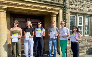 Ysgol Dyffryn Aman pupils celebrating their A-level results