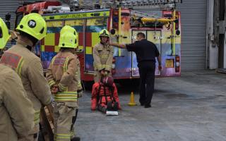 Aspiring firefighters are tested at a fire service experience day.
